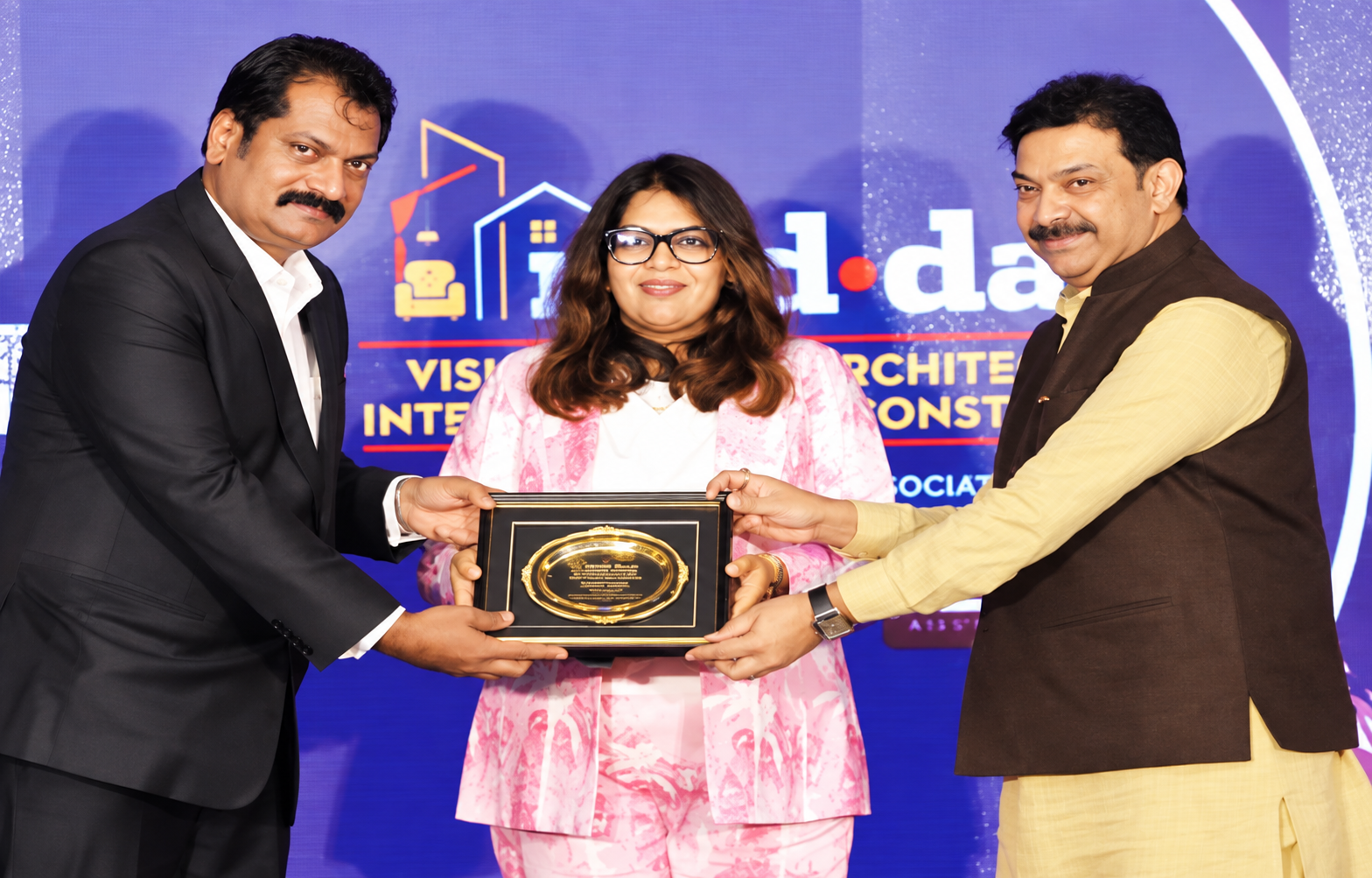 Pinakiin Designs receiving the Mid-Day recognition on stage